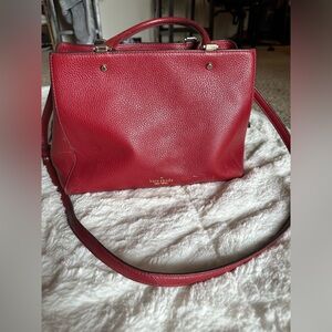 Kate spade purse over the shoulder and handles red